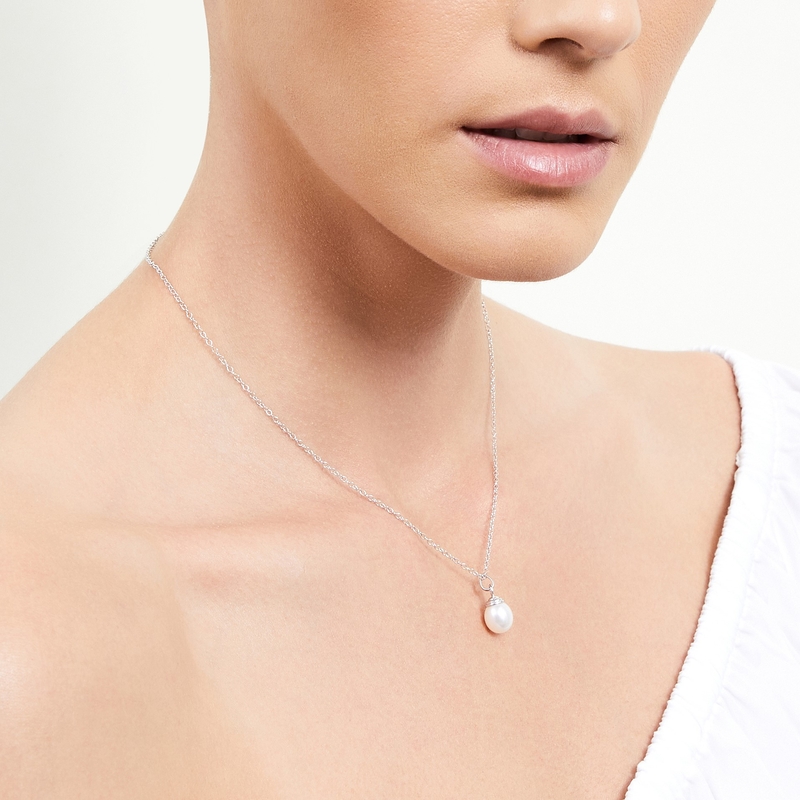 Model is wearing Drop Shape Hope Pendant with 8-9mm AAAA quality pearls